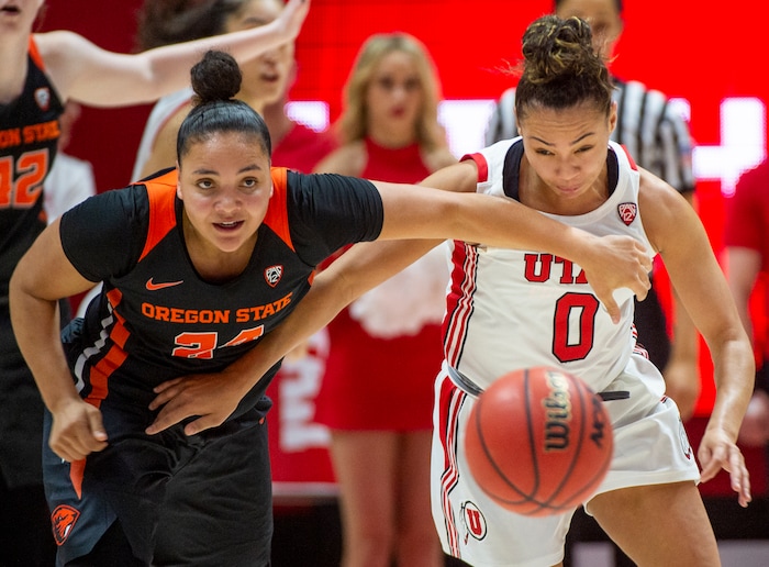 (Rick Egan  |  The Salt Lake Tribune)     Oregon State Beavers guard Destiny Slocum (24) and Utah Utes guard Kiana Moore (0) for after a loose ball, in PAC-12 basketball action between the Utah Utes and the Oregon State Beavers at the Jon M. Huntsman Center, Saturday, Feb. 1, 2020.