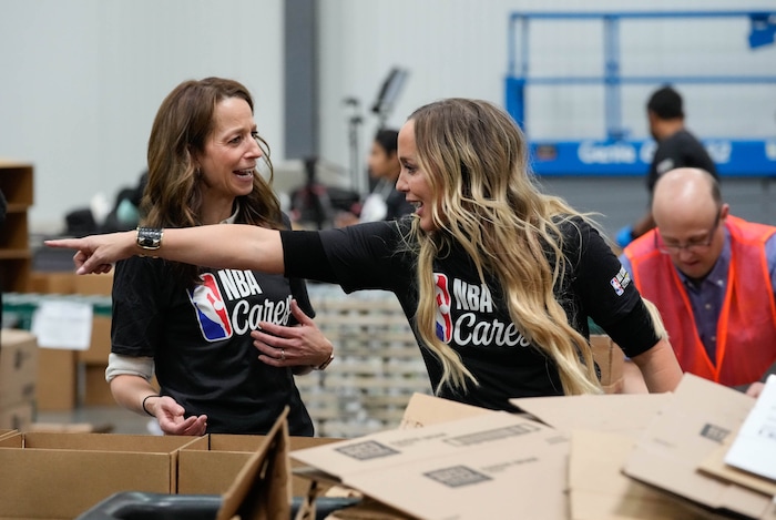 (Francisco Kjolseth | The Salt Lake Tribune) Utah First Lady Abby Cox, left, and Utah Jazz owner Ashley Smith help pack boxes with food during the NBA Cares Day of Service in Salt Lake City on Feb. 17, 2023.
