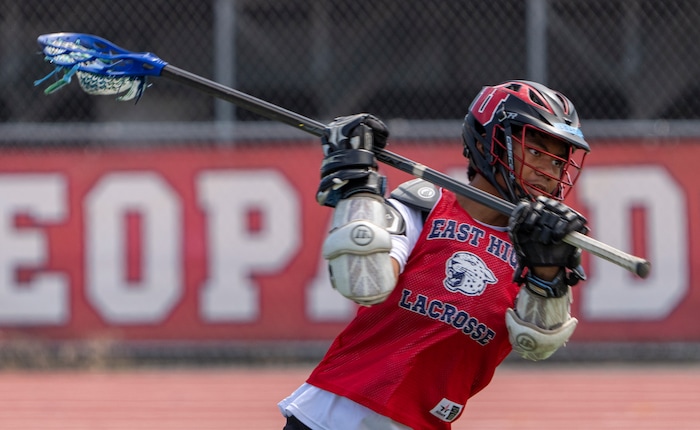 (Rick Egan | The Salt Lake Tribune)  Lolo Angilau runs drills, during East youth lacrosse practice, on Wednesday, June 22, 2022.
