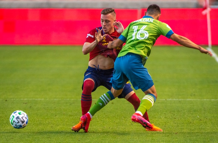 (Rick Egan  |  The Salt Lake Tribune)     Real Salt Lake forward Corey Baird (10) and Seattle Sounders midfielder Alex Roldan (16) go for the ball, in MLS soccer action between Real Salt Lake and the Seattle Sounders, at Rio Tinto Stadium, Wednesday, Sept. 2, 2020.