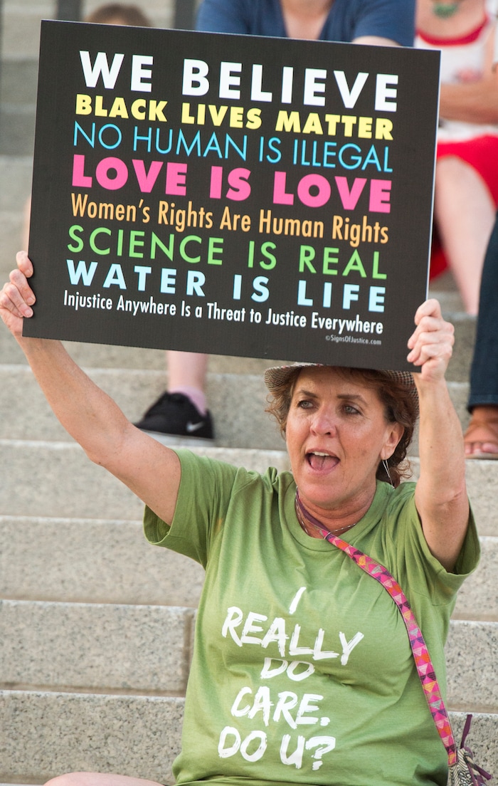 (Rick Egan  |  The Salt Lake Tribune)     Carolyn Howell joins in a chant at the Confront Corruption:Demand Democracy vigil on the steps of the Utah State Capitol, Wednesday. Salt Lake City joined more than 110 vigils nationwide to stand against corruption in the United States, July 18, 2018.