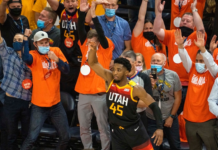 (Rick Egan | The Salt Lake Tribune) Utah Jazz fans react as Utah Jazz guard Donovan Mitchell (45) scores his 27th point in the first half of the game, with a 3-point shot in the final seconds of the first half, in second round playoff action in game 2 between the Utah Jazz and the LA Clippers, at Vivint Arena, on Thursday, June 10, 2021.
