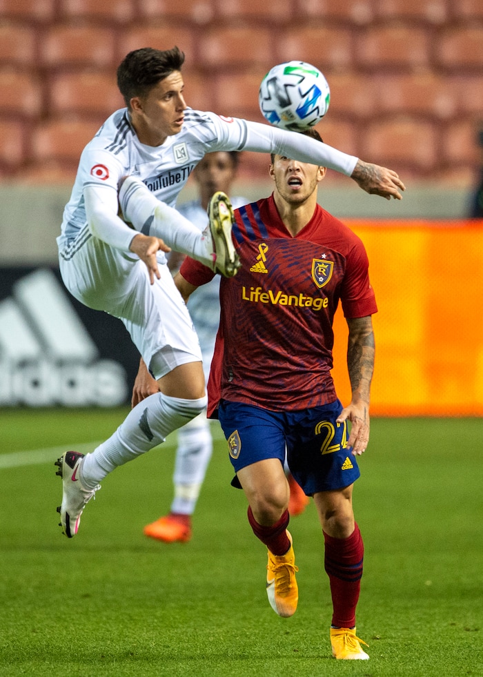 (Rick Egan  |  The Salt Lake Tribune).   Los Angeles FC midfielder Brian Rodriguez (17) kicks the ball as Real Salt Lake defender Aaron Herrera (22) defends, in MLS soccer action between Real Salt Lake and Los Angeles FC at Rio Tinto Stadium, on Wednesday, Sept. 9, 2020.