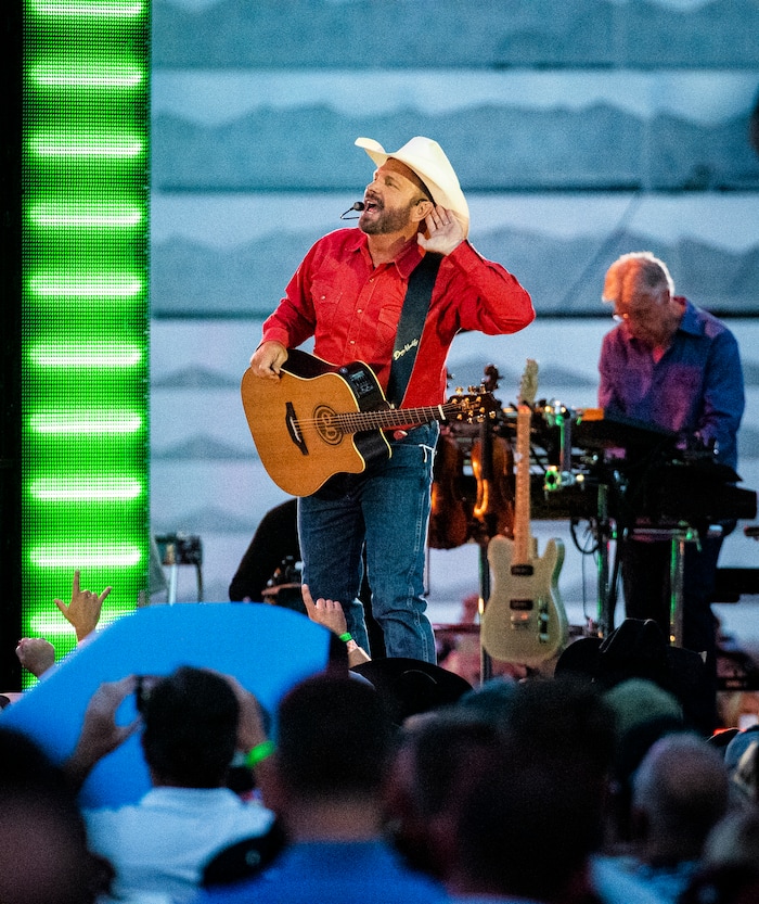 (Isaac Hale | Special to The Tribune) Garth Brooks gestures to the crowd as he performs with his band during a stop on their stadium tour held at Rice-Eccles Stadium in Salt Lake City on Saturday, July 17, 2021.