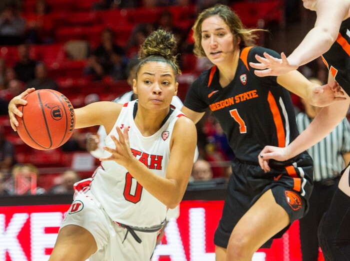 (Rick Egan  |  The Salt Lake Tribune)     Utah Utes guard Kiana Moore (0) takes the ball down the middle as Oregon State Beavers guard Aleah Goodman (1) defends, in PAC-12 basketball action between the Utah Utes and the Oregon State Beavers at the Jon M. Huntsman Center, Saturday, Feb. 1, 2020.