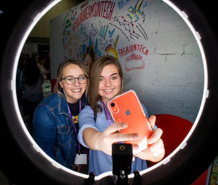 (Rick Egan  |  The Salt Lake Tribune)         Megan Duclof and Erika Rigby take a selfie at the SheTech Explorer Day event, at the Mountain America Expo Center in Sandy, Tuesday, April 9, 2019.