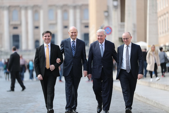 (Photo courtesy of The Church of Jesus Christ of Latter-day Saints) President Russell M. Nelson and President M. Russell Ballard emerge after their visit with Pope Francis in the Vatican on Saturday, March 9, 2019. Elders Massimo De Feo (left) and Alessandro Dini-Ciacci (right) of the Seventy accompanied them to the visit.