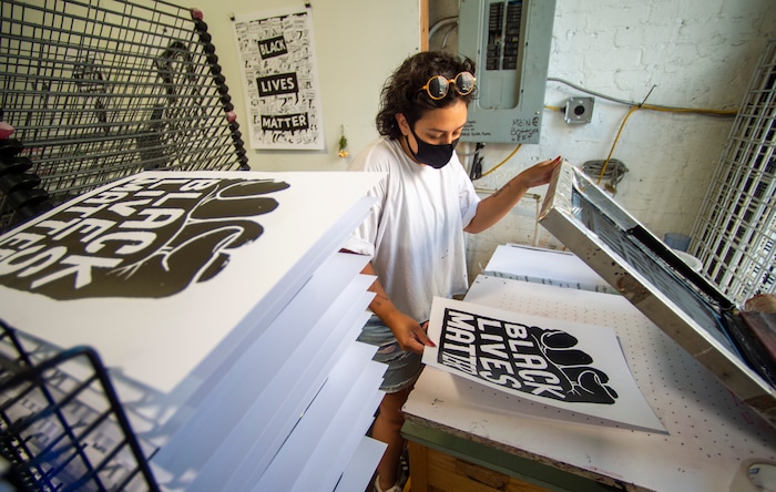 (Rick Egan  |  The Salt Lake Tribune)     Volunteer Taylar Jackson, makes silk screen prints for protest posters, Friday, June 26, 2020.