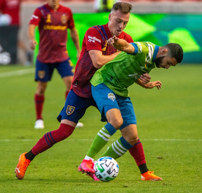 (Rick Egan  |  The Salt Lake Tribune)     Real Salt Lake forward Corey Baird (10) and Seattle Sounders midfielder Alex Roldan (16) go for the ball, in MLS soccer action between Real Salt Lake and the Seattle Sounders, at Rio Tinto Stadium, Wednesday, Sept. 2, 2020.