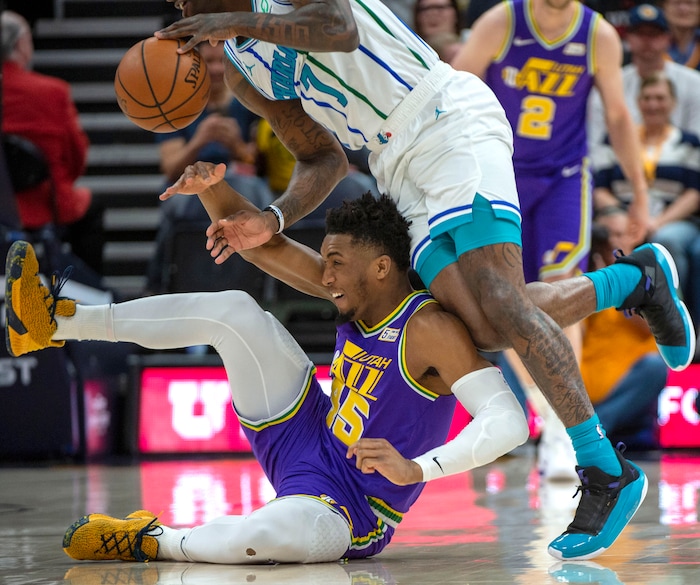 (Rick Egan  |  The Salt Lake Tribune)   Utah Jazz guard Donovan Mitchell (45) goes for a loose ball along with Charlotte Hornets guard Dwayne Bacon (7), in NBA action between the Utah Jazz and the Charlotte Hornets, in Salt Lake City,  Monday, April 1, 2019.