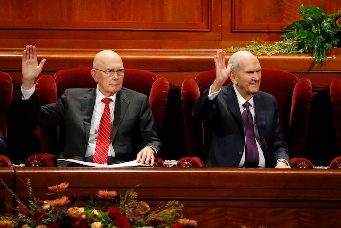 (Rick Bowmer  |  AP) President Russell M. Nelson, right, raises his hand during a sustaining vote with his counselor, Dallin H. Oaks, left, during The Church of Jesus Christ of Latter-day Saints' twice-annual church conference Saturday, Oct. 5, 2019, in Salt Lake City. Nelson has rolled out a number of policy changes during his first two years at the helm of the faith, leading to heightened anticipation for what he may announce at this weekend's conference in Salt Lake City.