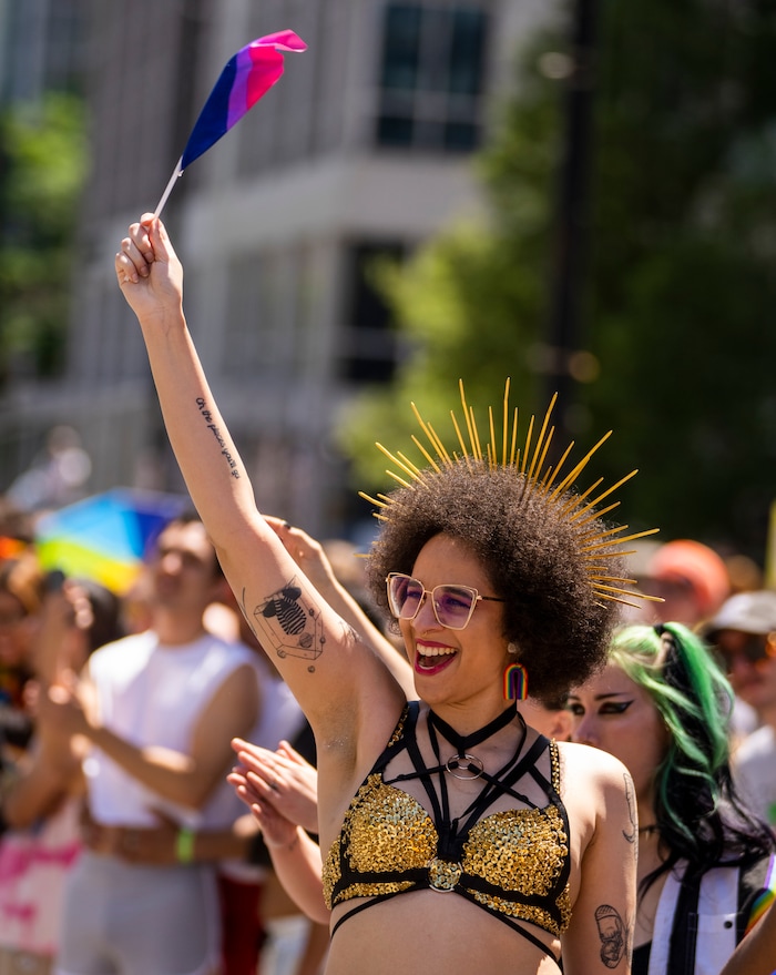 (Rick Egan | The Salt Lake Tribune)  Christina Bedford waves a flag in the Pride Parade, on Sunday, June 4, 2023.