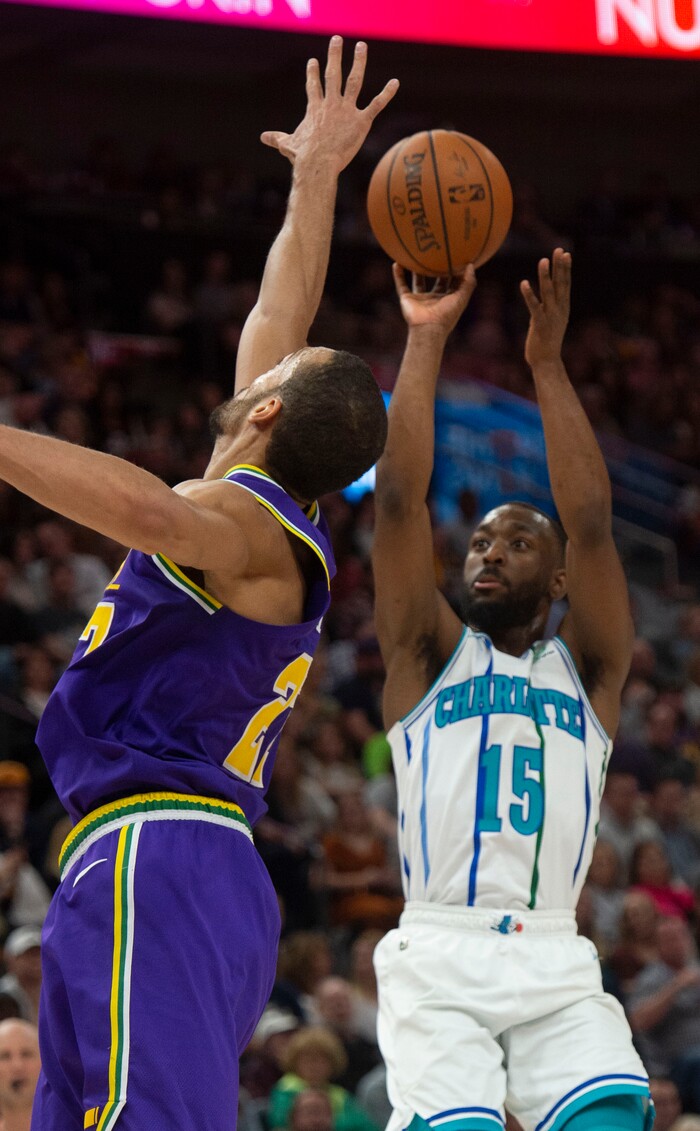 (Rick Egan  |  The Salt Lake Tribune)   Charlotte Hornets guard Kemba Walker (15) shoots as Utah Jazz center Rudy Gobert (27) defends, in NBA action between the Utah Jazz and the Charlotte Hornets, in Salt Lake City,  Monday, April 1, 2019.