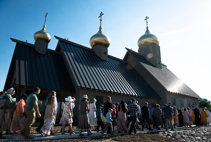 (Isaac Hale | Special to The Tribune) Members of the congregation are joined by Metropolitan Joseph, leader of the Antiochian Orthodox Christian Archdiocese of North America, and clergy as they all process around the church during a consecration service for St. Xenia Orthodox Church in Payson on Saturday, July 16, 2022.