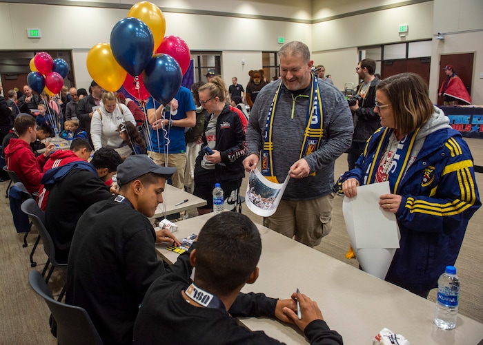 (Rick Egan  |  The Salt Lake Tribune)    Fans get autographs with The Real Monarchs, as they celebrate their USL Cup Championship, during their championship parade at Lynn Crane Park in Herriman, Wednesday, Nov. 20, 2019.