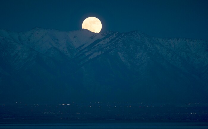 (Rick Egan  |  The Salt Lake Tribune)   The largest and brightest supermoon of 2018 rises over the Wasatch mountains, as seen from Antelope Island, Monday, January 1, 2018.