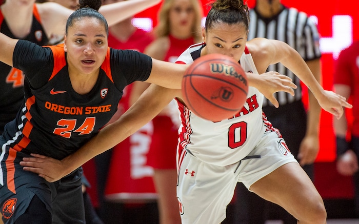 (Rick Egan  |  The Salt Lake Tribune)     Oregon State Beavers guard Destiny Slocum (24) and Utah Utes guard Kiana Moore (0) for after a loose ball, in PAC-12 basketball action between the Utah Utes and the Oregon State Beavers at the Jon M. Huntsman Center, Saturday, Feb. 1, 2020.