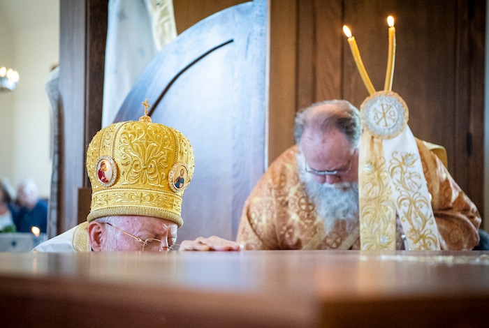 (Isaac Hale | Special to The Tribune) Metropolitan Joseph, leader of the Antiochian Orthodox Christian Archdiocese of North America, prays at the holy table as he and other clergy prepare to wash it during a consecration service for St. Xenia Orthodox Church in Payson on Saturday, July 16, 2022.