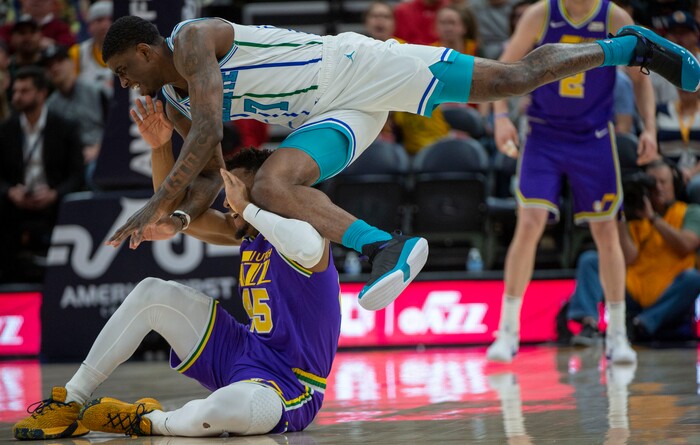 (Rick Egan  |  The Salt Lake Tribune)   Utah Jazz guard Donovan Mitchell (45) goes for a loose ball along with Charlotte Hornets guard Dwayne Bacon (7), in NBA action between the Utah Jazz and the Charlotte Hornets, in Salt Lake City,  Monday, April 1, 2019.