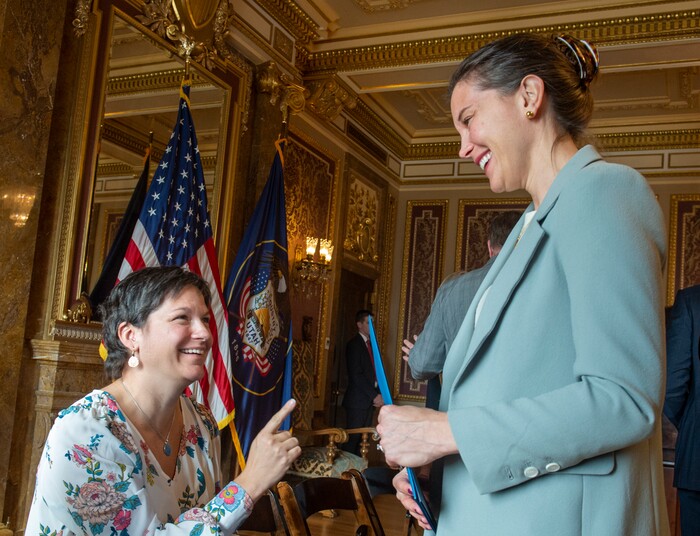 (Rick Egan  |  The Salt Lake Tribune)       Olympic skater Catherine Raney-Norman talks to Salt Lake City Mayor Erin Mendenhall, after a news conference announcing Utah's next steps towards an Olympic and Paralympic Winter Games, at the Utah State Capitol, Wednesday, Feb. 12, 2020.