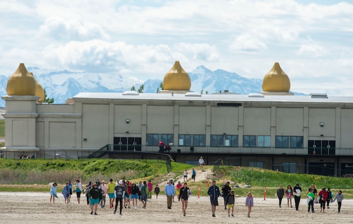 (Rick Egan  |  The Salt Lake Tribune)       Participants make their way to the water, at the shores of the Great Salt Lake Saturday, June 8, 2019.  The cool temperatures resulted in a crowd of around 300 people, so the attempt to break the world record was turned into a polar plunge.