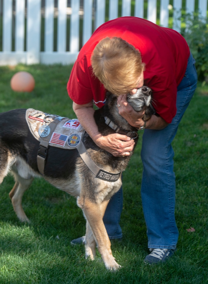 (Rick Egan | The Salt Lake Tribune) Linda Crismer hugs Mazzie, one of two veteran military canine she and her husband adopted from Kuwait, is photographed Wednesday, Aug. 28, 2019. The dogs were rescued part of an effort to save dogs abandoned by the U.S. military after their handlers return home from duty.
