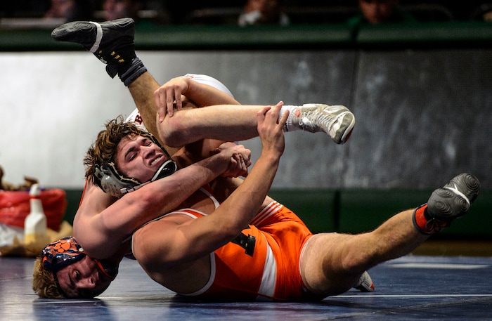 (Steve Griffin  |  The Salt Lake Tribune) Zac Musselman, of Monticello, center, his to escape the hold of Brighton's Brayden Stevens during the All-Star Duals wrestling at Utah Valley University's UCCU Center in Orem Tuesday January 9, 2018.