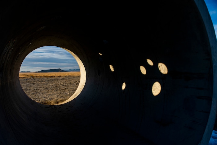 (Rick Egan | The Salt Lake Tribune)  Light reflects inside the famed Sun Tunnels sculpture, during a unique winter solstice in remote Utah's Great Basin Desert, on Monday, Dec. 21, 2020.