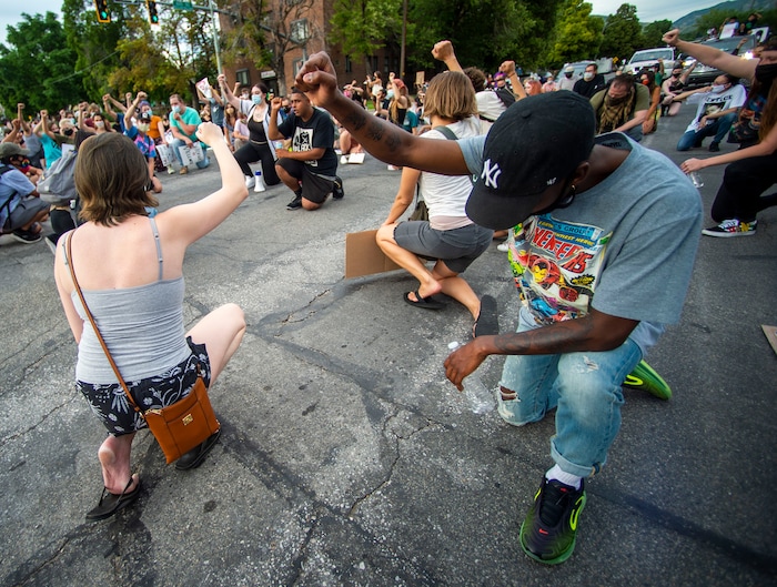 (Rick Egan  |  The Salt Lake Tribune)     Protesters stop and take a knee in remembrance of Bernardo in a Salt Lake City intersection, during a Justice for Bernardo rally on Thursday, June 25, 2020.