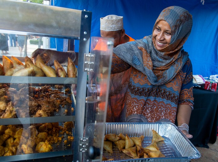(Rick Egan  |  The Salt Lake Tribune)     Najati Abbanna cooks Swahili Cuisine in the Namash booth at the Gallivan Center, as Salt Lake City's Spice Kitchen Incubator program serves a variety of international cuisine at the welcome party for the United Nations Civil Society Conference, Sunday, Aug. 25, 2019.