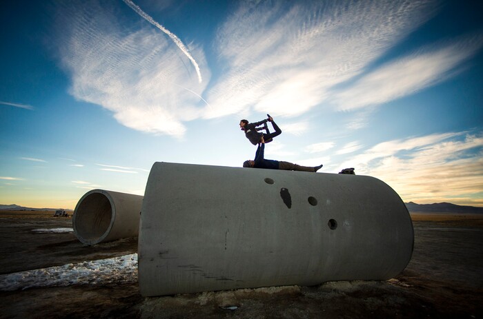 (Rick Egan | The Salt Lake Tribune)   Chris Knoles and Roxy Christensen do Acro Yoga on top of the Sun Tunnels, as revelers celebrate a unique winter solstice at the famed sculpture in remote Utah’s Great Basin Desert, on Monday, Dec. 21, 2020. For the first time in 800 years, Saturn and Jupiter align to create a single, bright point of light known as the “Christmas Star.”