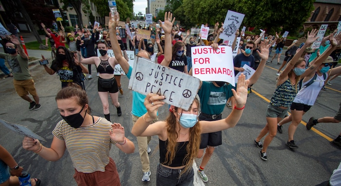 (Rick Egan  |  The Salt Lake Tribune)     Protesters shout "hands up don't shoot" asa they march down the street in Salt Lake City, during a Justice for Bernardo rally on Thursday, June 25, 2020.