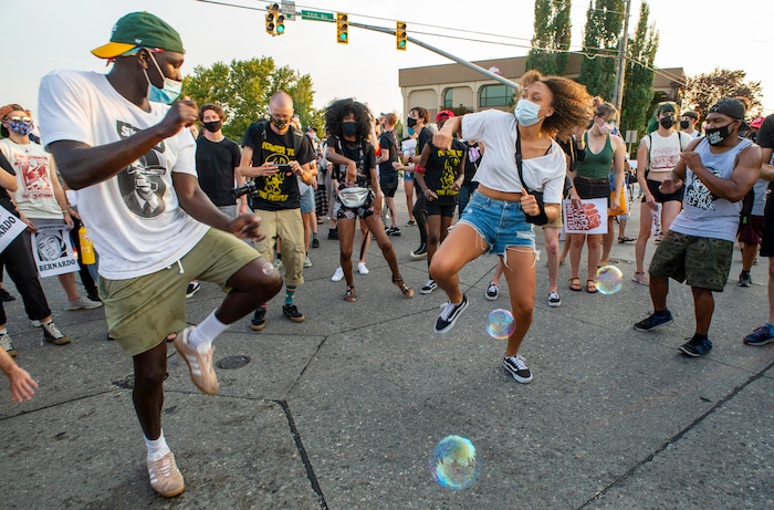 (Rick Egan  |  The Salt Lake Tribune)     Protesters stop on Redwood Road to dance, during the Dance Dance for Revolution protest in Rose Park on Sunday, Aug. 23, 2020. The protest was in memory of Jovany Mercardo who was shot last August by Ogden police by four officers, hitting his body sixteen times.