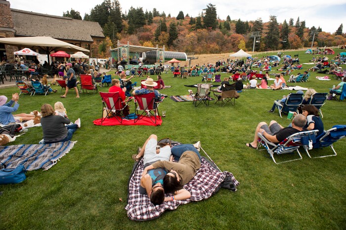 (Rick Egan  |  The Salt Lake Tribune)   Festivalgoers relax on blankets, as the band Night Marcher performs, at the Blues, Brews & BBQ festival at Snowbasin resort,  Sunday, Sept. 23, 2018.