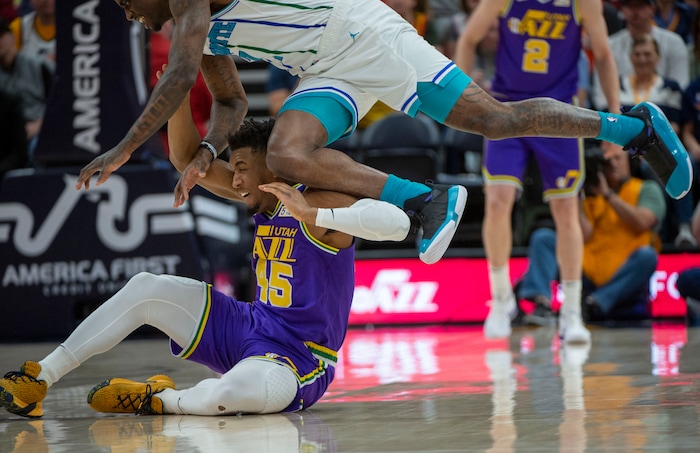(Rick Egan  |  The Salt Lake Tribune)   Utah Jazz guard Donovan Mitchell (45) goes for a loose ball along with Charlotte Hornets guard Dwayne Bacon (7), in NBA action between the Utah Jazz and the Charlotte Hornets, in Salt Lake City,  Monday, April 1, 2019.