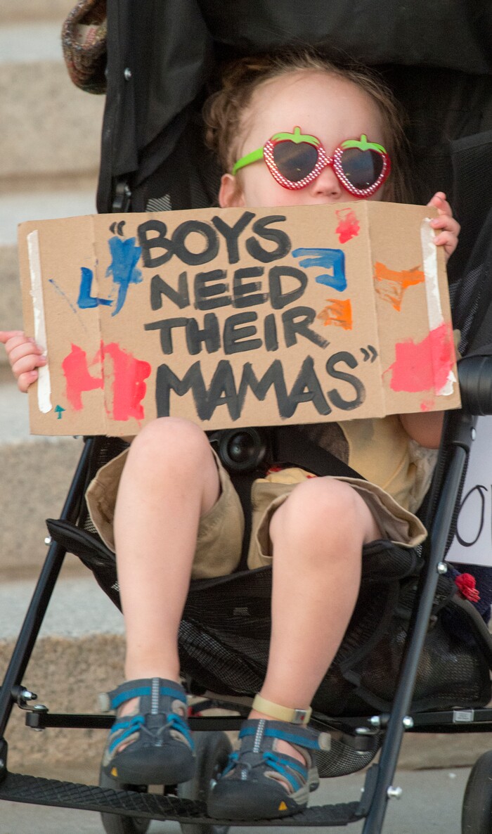 (Rick Egan  |  The Salt Lake Tribune)     Ezra Weitz holds a sign at the Confront Corruption:Demand Democracy vigil on the steps of the Utah State Capitol, Wednesday. Salt Lake City joined more than 110 vigils nationwide to stand against corruption in the United States, July 18, 2018.