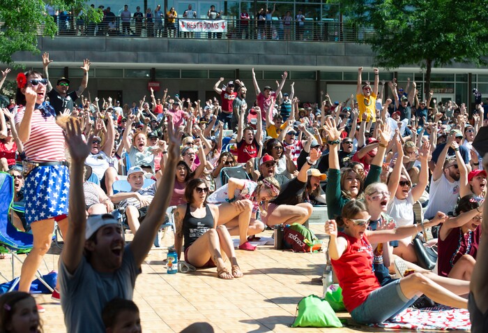(Rick Egan  |  The Salt Lake Tribune)   Soccer fans celebrate as the US women's team scores a goal against the Netherlands in the World Cup final, during a watch party at the Gallivan Center in Salt Lake, Sunday, July 7, 2019.