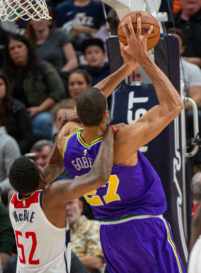 (Rick Egan  |  The Salt Lake Tribune)        Washington Wizards guard Jordan McRae (52) is called for a foul, as he tries to prevent Utah Jazz center Rudy Gobert (27) from scoring late in the game, in NBA action between the Utah Jazz and the Washington Wizards, in Salt Lake City, Friday, March 29, 2019.