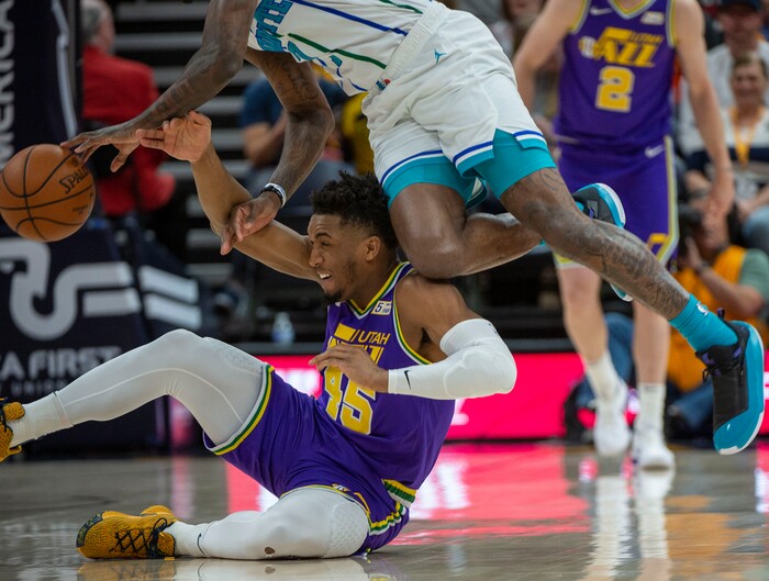 (Rick Egan  |  The Salt Lake Tribune)   Utah Jazz guard Donovan Mitchell (45) goes for a loose ball along with Charlotte Hornets guard Dwayne Bacon (7), in NBA action between the Utah Jazz and the Charlotte Hornets, in Salt Lake City,  Monday, April 1, 2019.