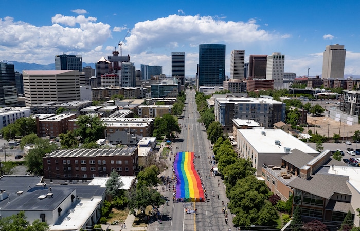 (Francisco Kjolseth | The Salt Lake Tribune) The large rainbow flag that takes up the rear of the Utah Pride Parade is carried in Salt Lake City on Sunday, June 4, 2023.