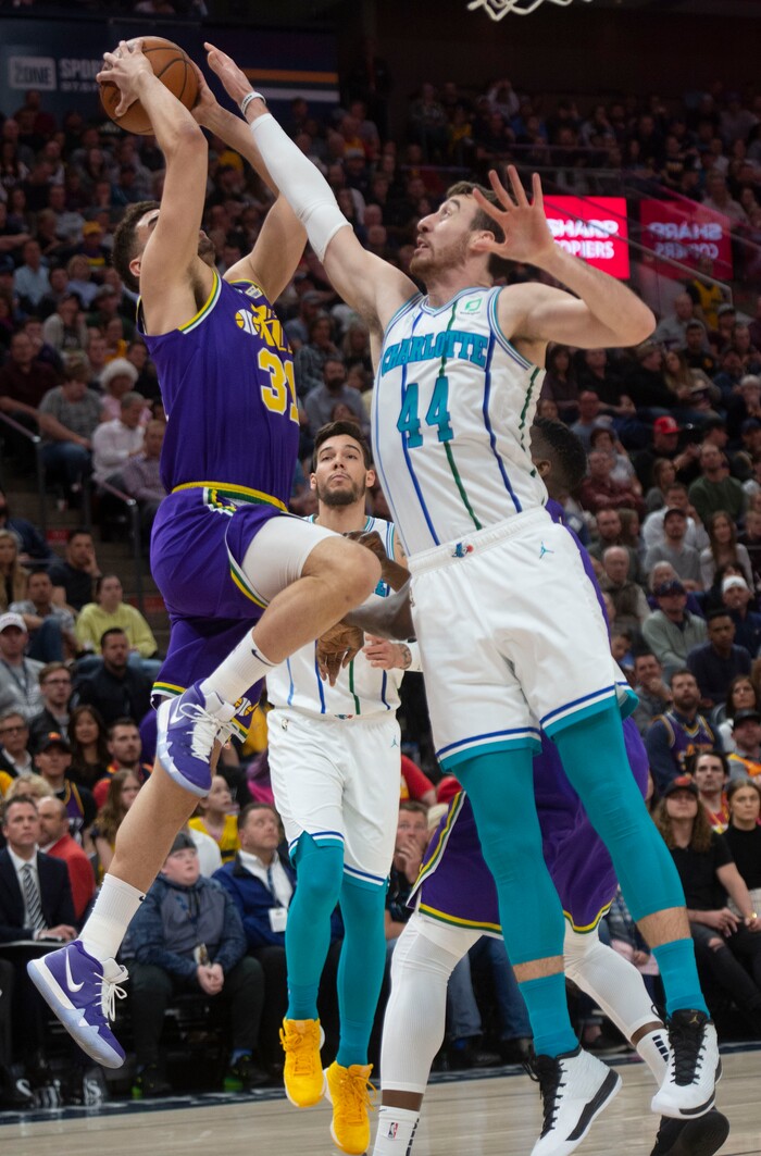 (Rick Egan  |  The Salt Lake Tribune)   Utah Jazz forward Georges Niang (31) shoots the ball, as Charlotte Hornets forward Frank Kaminsky (44) defends, in NBA action between the Utah Jazz and the Charlotte Hornets, in Salt Lake City,  Monday, April 1, 2019.
