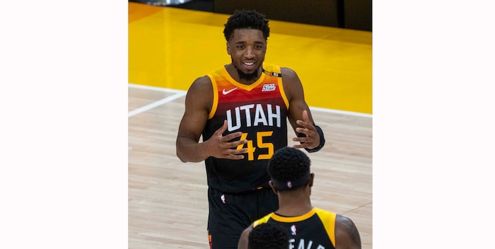 (Rick Egan | The Salt Lake Tribune)Utah Jazz guard Donovan Mitchell (45) smiles at Utah Jazz forward Royce O'Neale (23) at the end of the second half, in second round playoff action in game 2 between the Utah Jazz and the LA Clippers, at Vivint Arena, on Thursday, June 10, 2021.