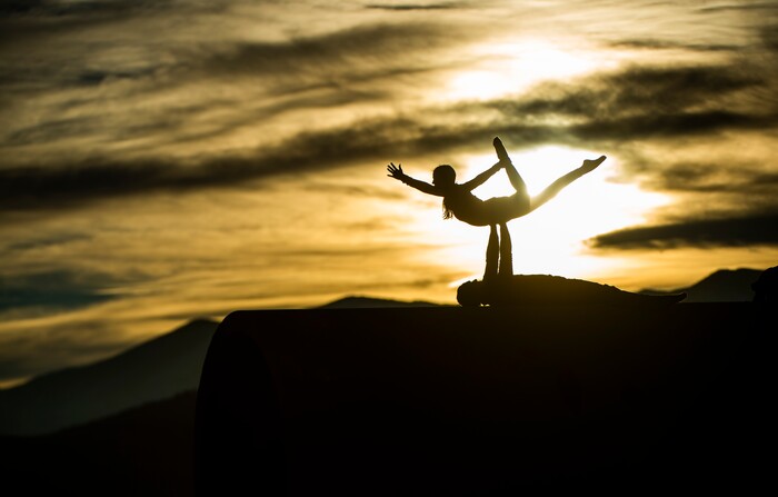 (Rick Egan | The Salt Lake Tribune)   Chris Knoles and Roxy Christensen do Acro Yoga on top of the Sun Tunnels, as revelers celebrate a unique winter solstice near the famed Sun Tunnels sculpture in remote Utah's Great Basin Desert, on Monday, Dec. 21, 2020. For the first time in 800 years, Saturn and Jupiter align to create a single, bright point of light known as the "Christmas Star."
