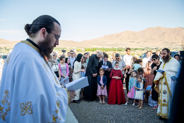 (Isaac Hale | Special to The Tribune) Benjamin Havens, 12, center, reads as he along with priests, deacons and subdecacons take part in a consecration service for St. Xenia Orthodox Church in Payson on Saturday, July 16, 2022.