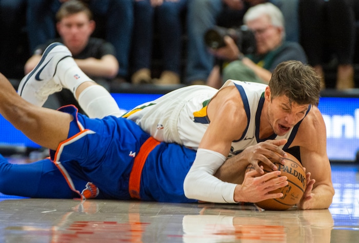 (Rick Egan  |  The Salt Lake Tribune)   Utah Jazz guard Kyle Korver (26) goes after loose ball along with New York Knicks guard Allonzo Trier (14) in NBA action between Utah Jazz and New York Knicks, in Salt Lake City, Saturday, Dec. 29, 2018.