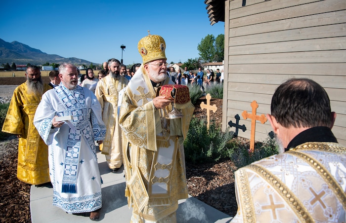 (Isaac Hale | Special to The Tribune) Metropolitan Joseph, leader of the Antiochian Orthodox Christian Archdiocese of North America, along with clergy and members of the congregation process around the church during a consecration service for St. Xenia Orthodox Church in Payson on Saturday, July 16, 2022.