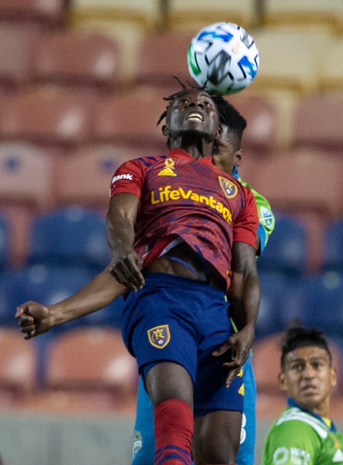 (Rick Egan  |  The Salt Lake Tribune)   Real Salt Lake forward Sam Johnson (50) and Seattle Sounders defender Kelvin Leerdam (18) go for the ball, in MLS soccer action between Real Salt Lake and the Seattle Sounders, at Rio Tinto Stadium, Wednesday, Sept. 2, 2020.