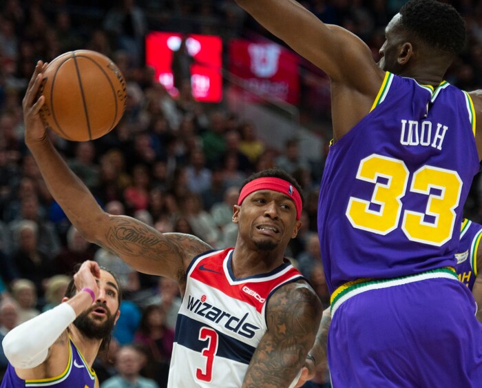 (Rick Egan  |  The Salt Lake Tribune)        Washington Wizards guard Bradley Beal (3) tosses a pass as Utah Jazz center Ekpe Udoh (33) defends, in NBA action between the Utah Jazz and the Washington Wizards, in Salt Lake City, Friday, March 29, 2019.
