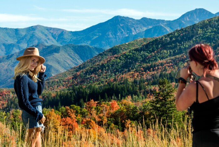 (Rick Egan  |  The Salt Lake Tribune)      Madi Thatcher poses for Kylee Cornwell as she takes a photo with the fall leaves in the background along the Alpine Loop Road in American Fork Canyon, Thursday, Sept. 26, 2019.