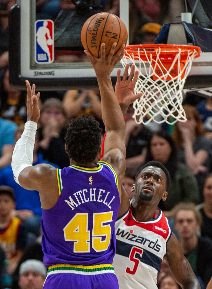 (Rick Egan  |  The Salt Lake Tribune)        Utah Jazz guard Donovan Mitchell (45) shoots over Washington Wizards forward Bobby Portis (5), in NBA action between the Utah Jazz and the Washington Wizards, in Salt Lake City, Friday, March 29, 2019.  Mitchell had a game high 35 points in the game
